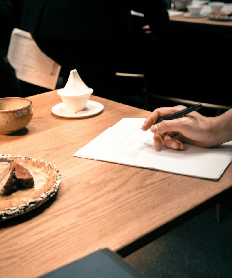 A student working through notes one-to-one at a desk